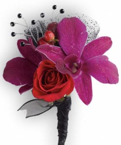 purple orchids with red spray roses and hypericum.