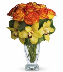 Aloha is a celebration of joy, gratitude and being in the present. Lovely orchids celebrate the spirit of aloha, especially when mixed with gorgeous roses evocative of a Hawaiian sunset.