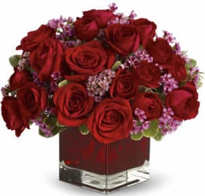 18 red roses. A vision in red with lavender accents, this beautiful gift is a poignant way to celebrate love that endures.