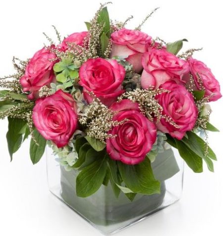 A dozen colorful roses nestled in antique hydrangea in a leaf lined cube. Available in pink, lavender, yellow, orange and multi-colored.