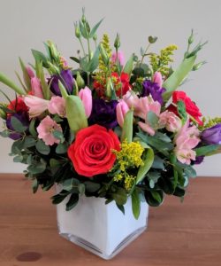 Bursting with locally grown tulips and lisianthus, this bright cube will sure make any recipient smile. Great for birthday, get well or just because.